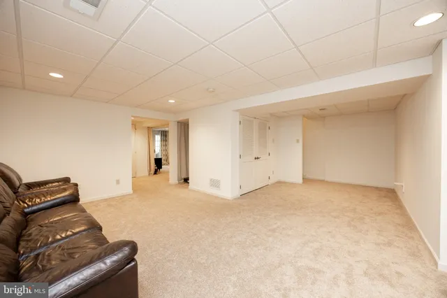 a view of an empty room and a window