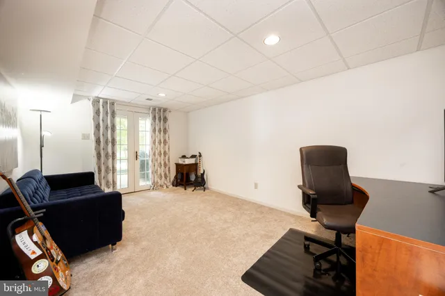 a view of a workspace with furniture and a couch