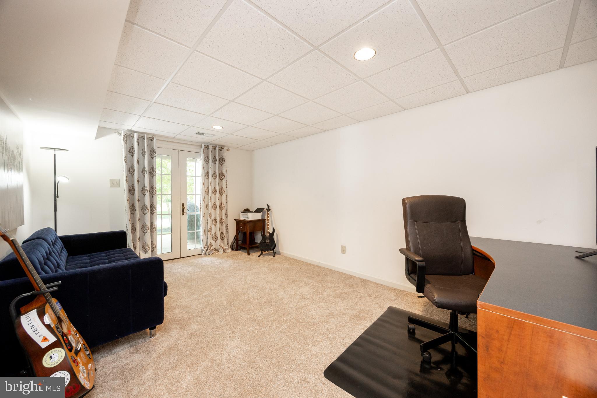 214 Windgate Drive Chester Springs, PA 19425 - Photo 36 of 45 a view of a workspace with furniture and a couch