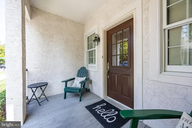 a view of room with window and furniture