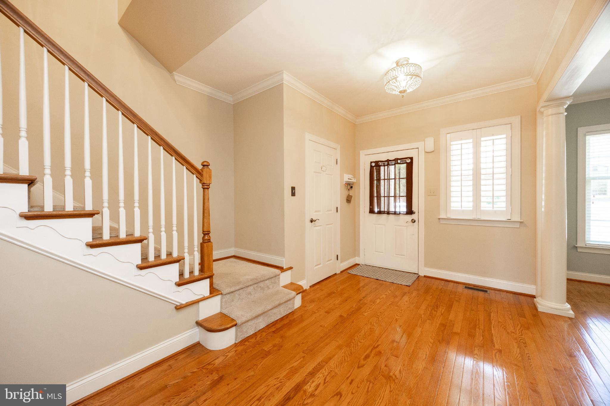 214 Windgate Drive Chester Springs, PA 19425 - Photo 5 of 45 a view of an empty room with stairs and a window