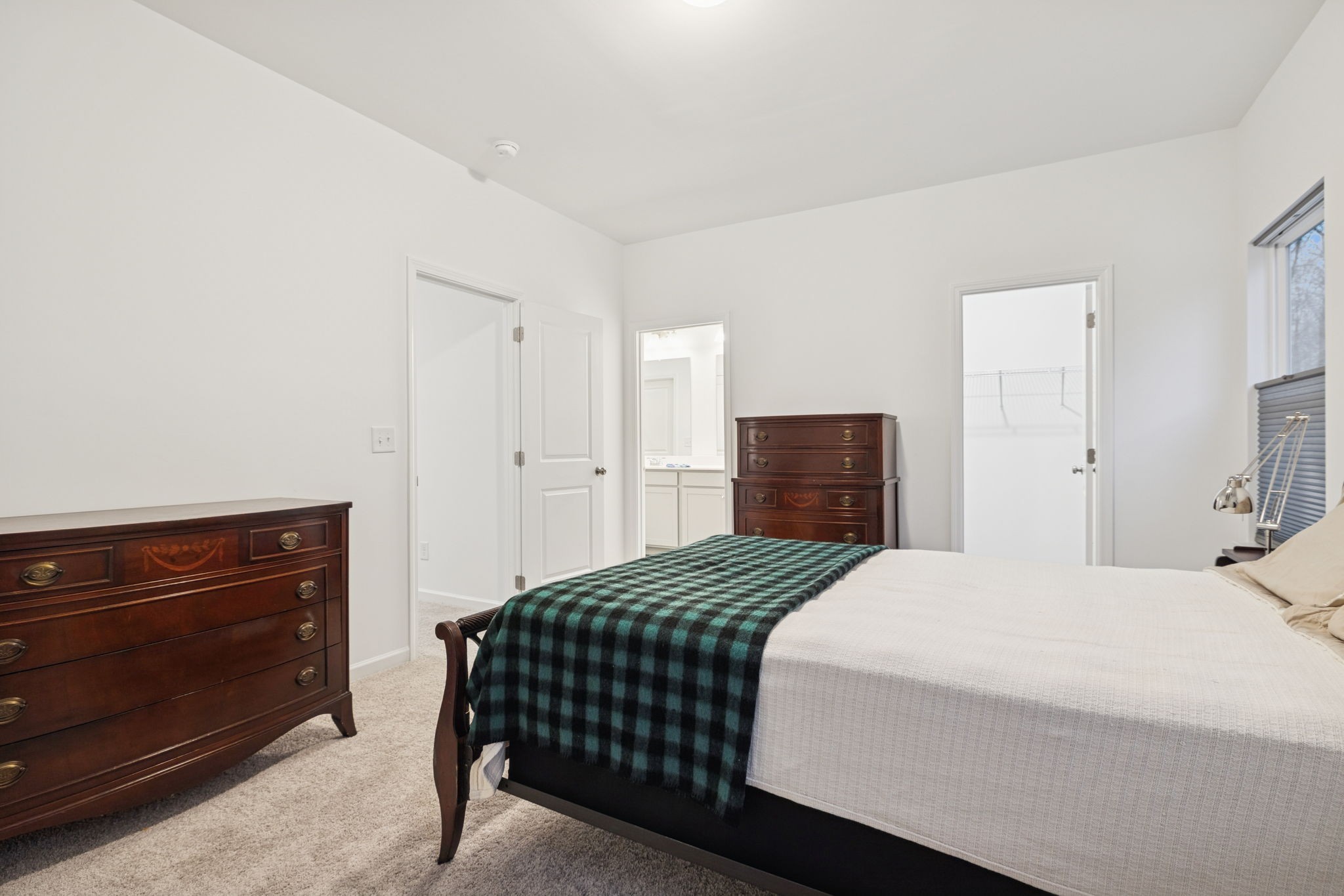 129 Ironhorse Way Dickson, TN 37055 - Photo 12 of 35 a bedroom with a bed and a dresser