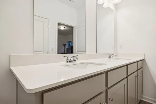 a view of a room with table and chairs