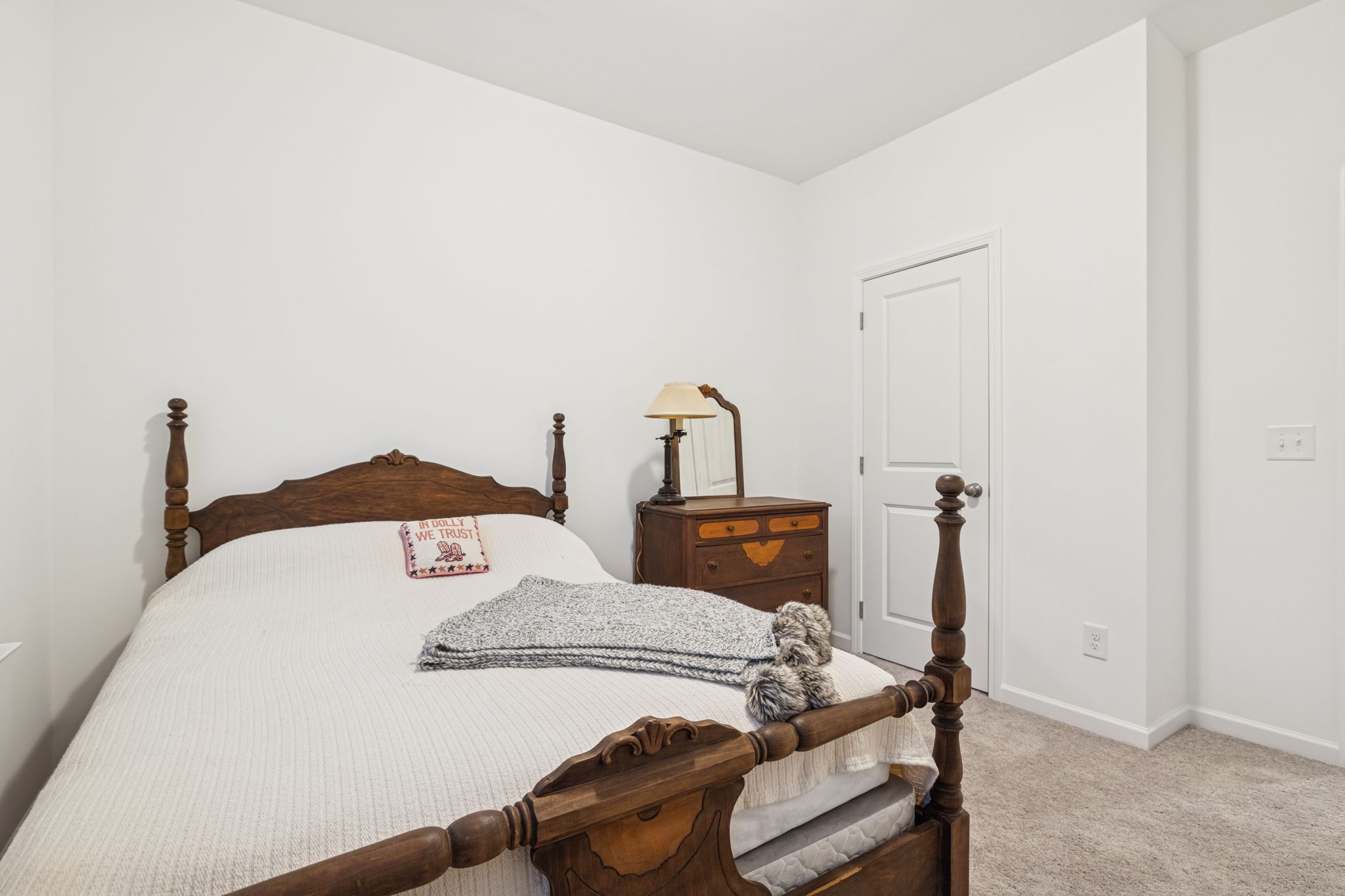 129 Ironhorse Way Dickson, TN 37055 - Photo 18 of 35 a bed sitting in a bedroom next to a window