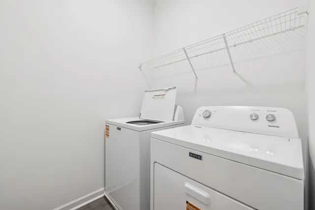 a front view of a house with large windows