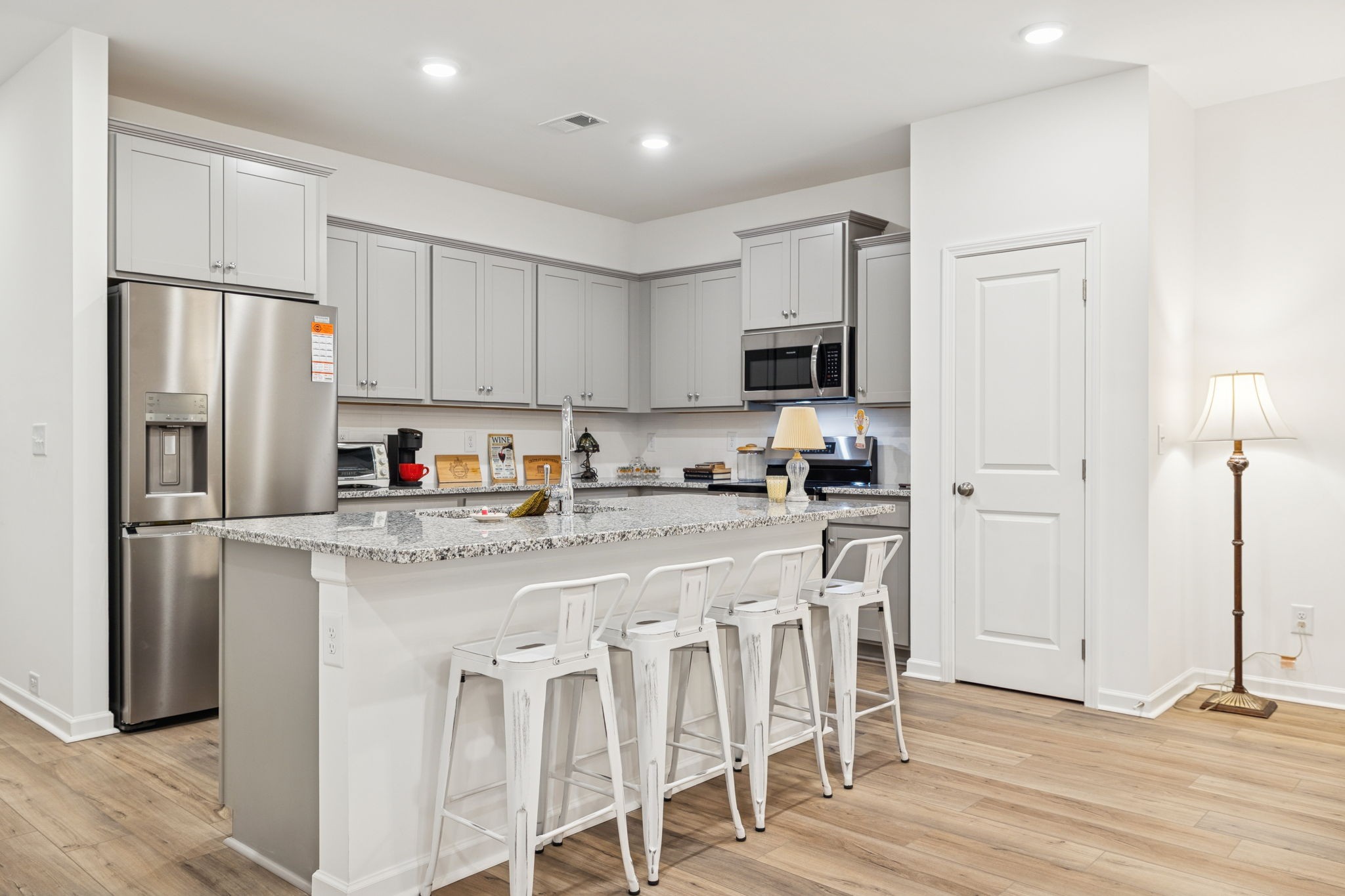 129 Ironhorse Way Dickson, TN 37055 - Photo 5 of 35 a kitchen with stainless steel appliances granite countertop a refrigerator and a stove top oven