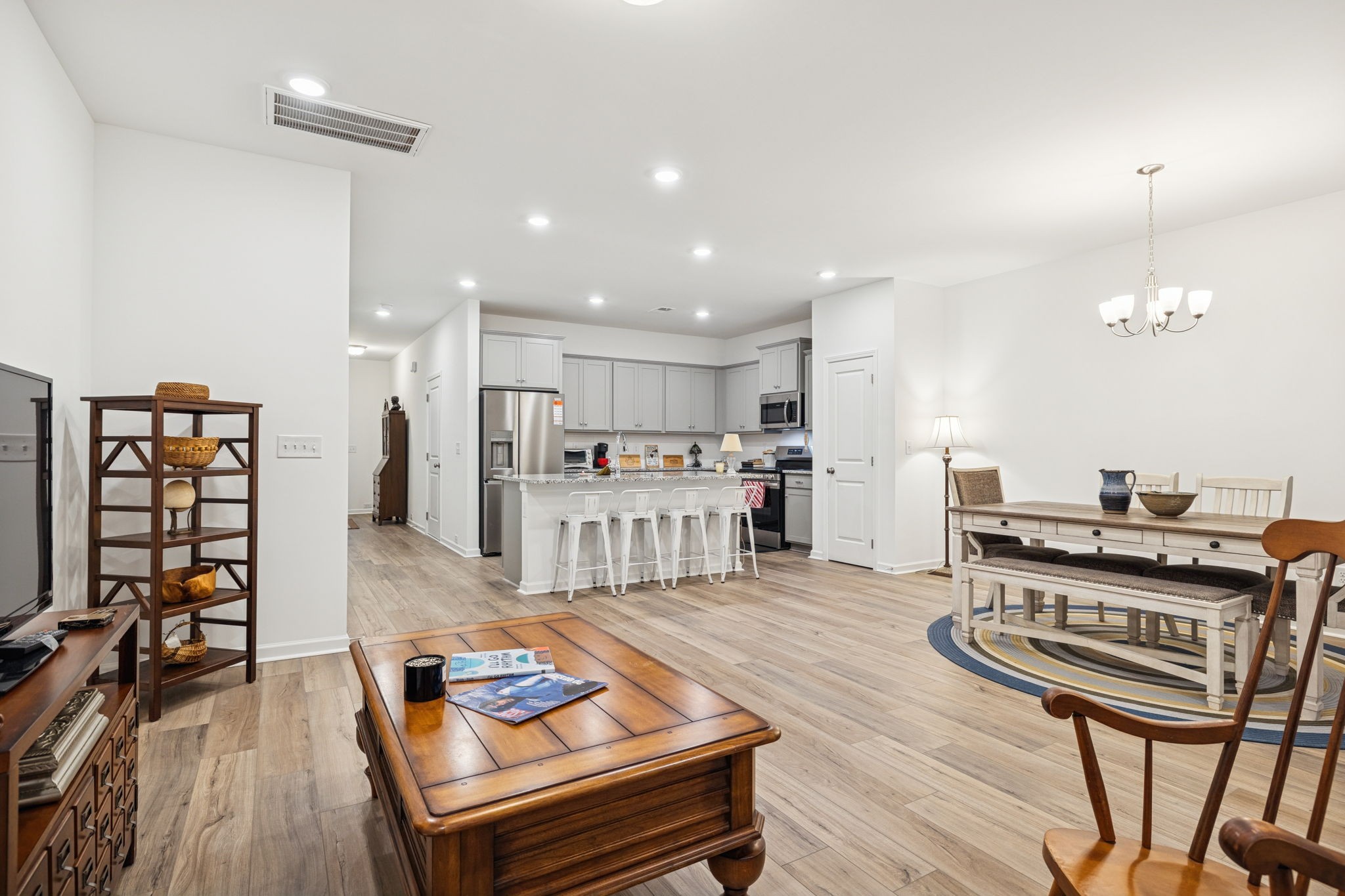 129 Ironhorse Way Dickson, TN 37055 - Photo 8 of 35 a living room with furniture and a table with wooden floor