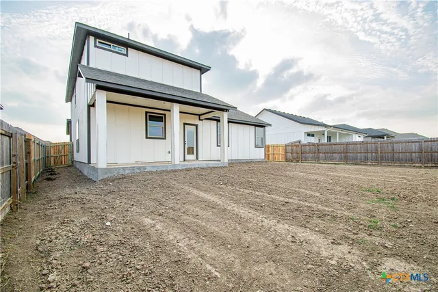 a view of backyard of house