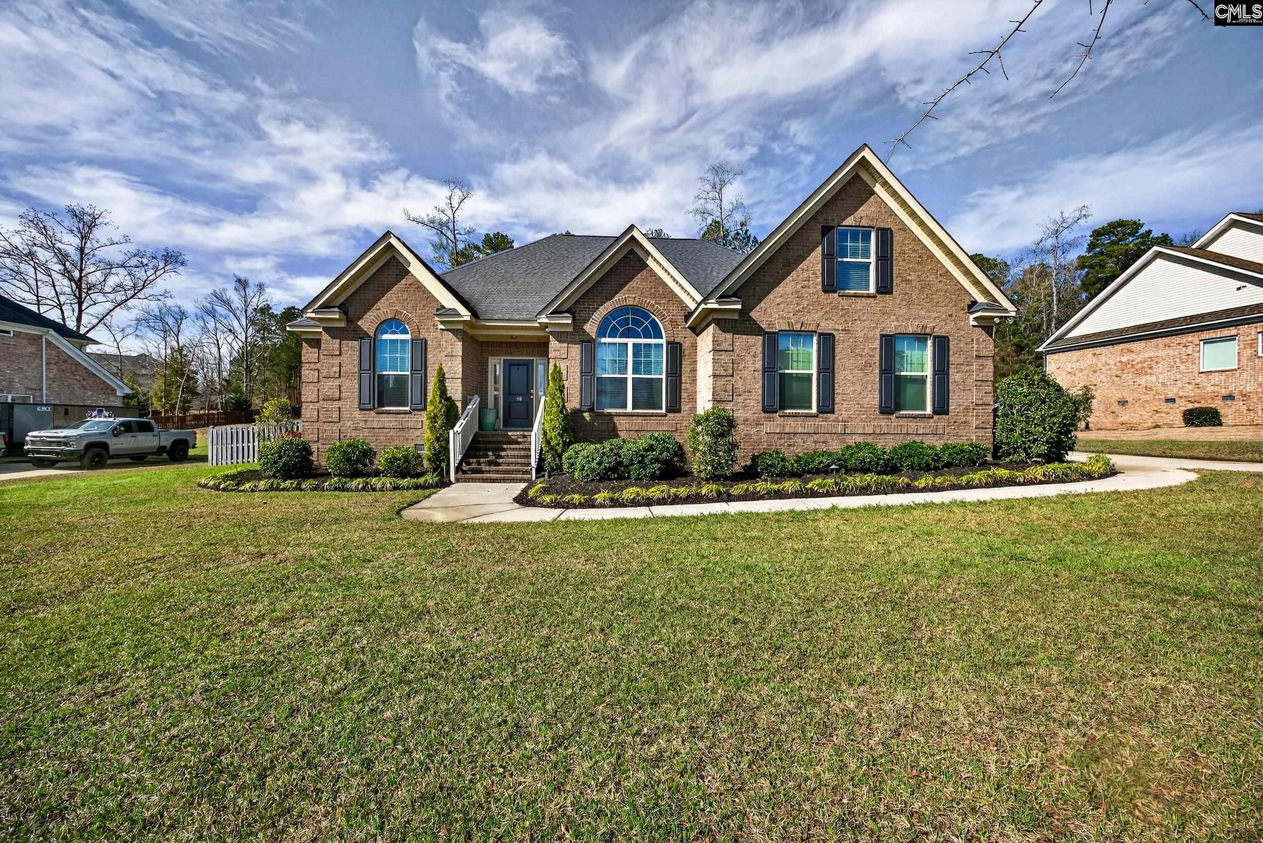 116 Renard Way Gilbert, SC 29054 - Photo 2 of 74 a front view of a house with a yard and garage