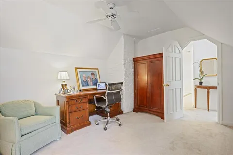 a view of a livingroom with workspace and a couch