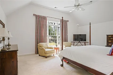 a bedroom with a bed and a couch