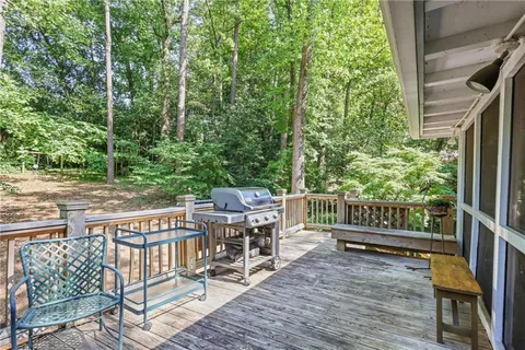 a view of a patio with a table and chairs