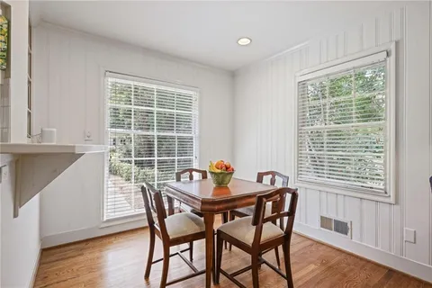 a dining room with furniture and windows