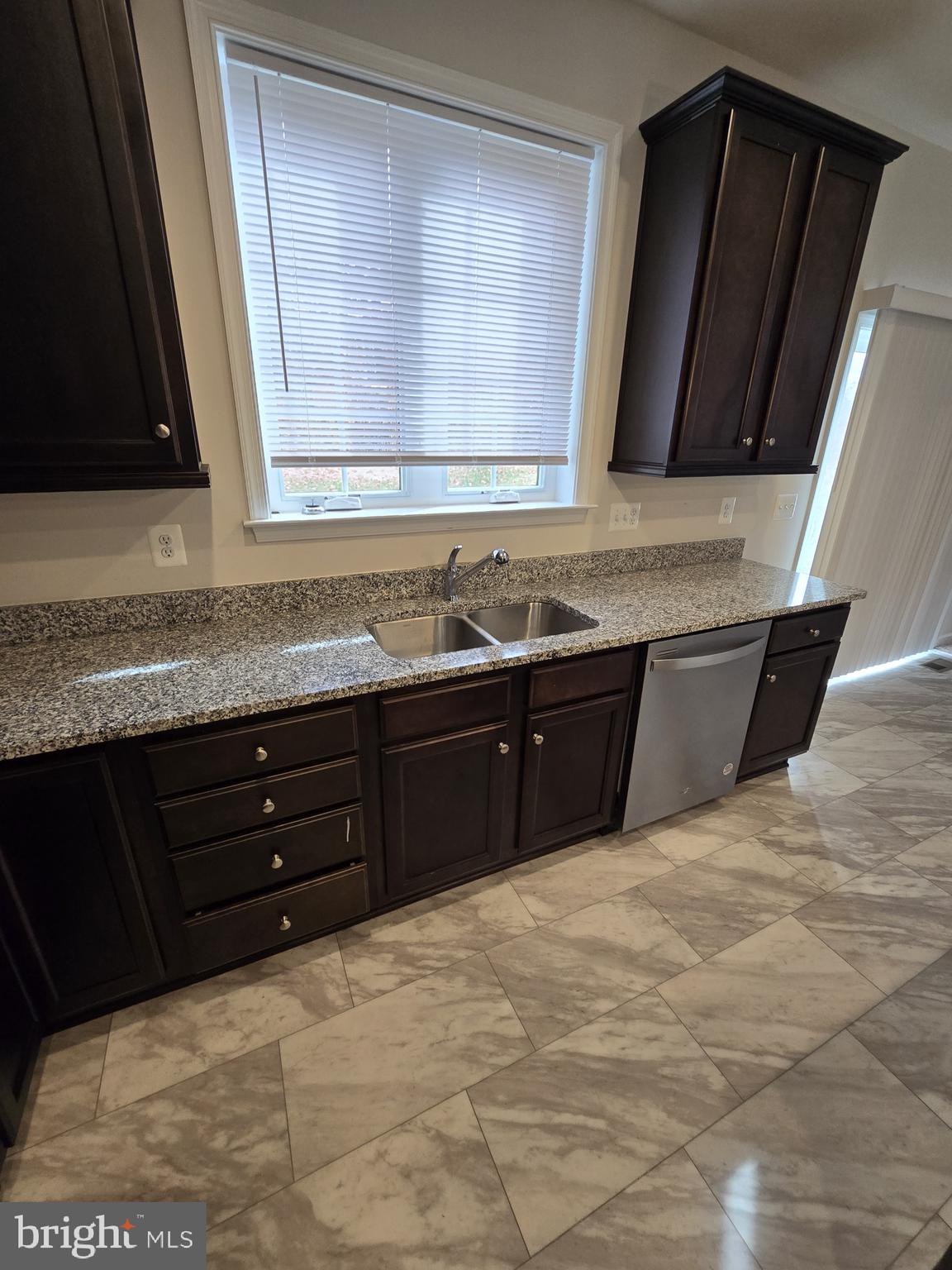 6592 Timber Ridge Lane Bryans Road, MD 20616 - Photo 13 of 60 a kitchen with a sink and a mirror