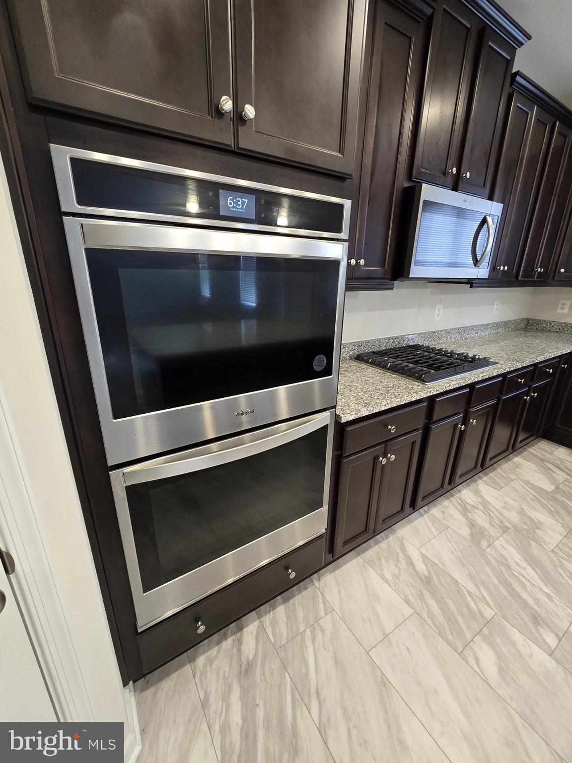6592 Timber Ridge Lane Bryans Road, MD 20616 - Photo 16 of 60 a stove top oven sitting inside of a kitchen