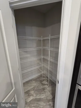 a view of a big room with windows and cabinet
