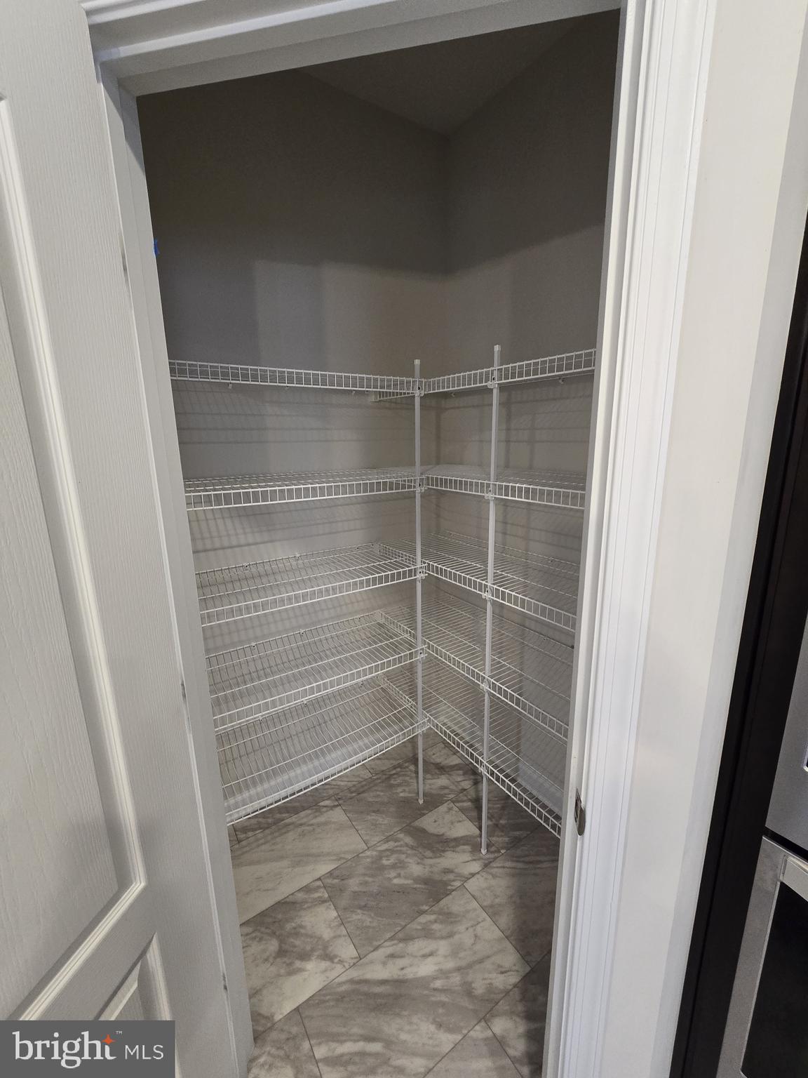 6592 Timber Ridge Lane Bryans Road, MD 20616 - Photo 18 of 60 a view of walk in closet with empty racks