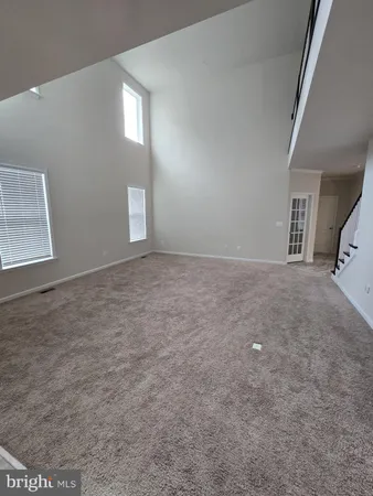 a bathroom with a toilet and a window