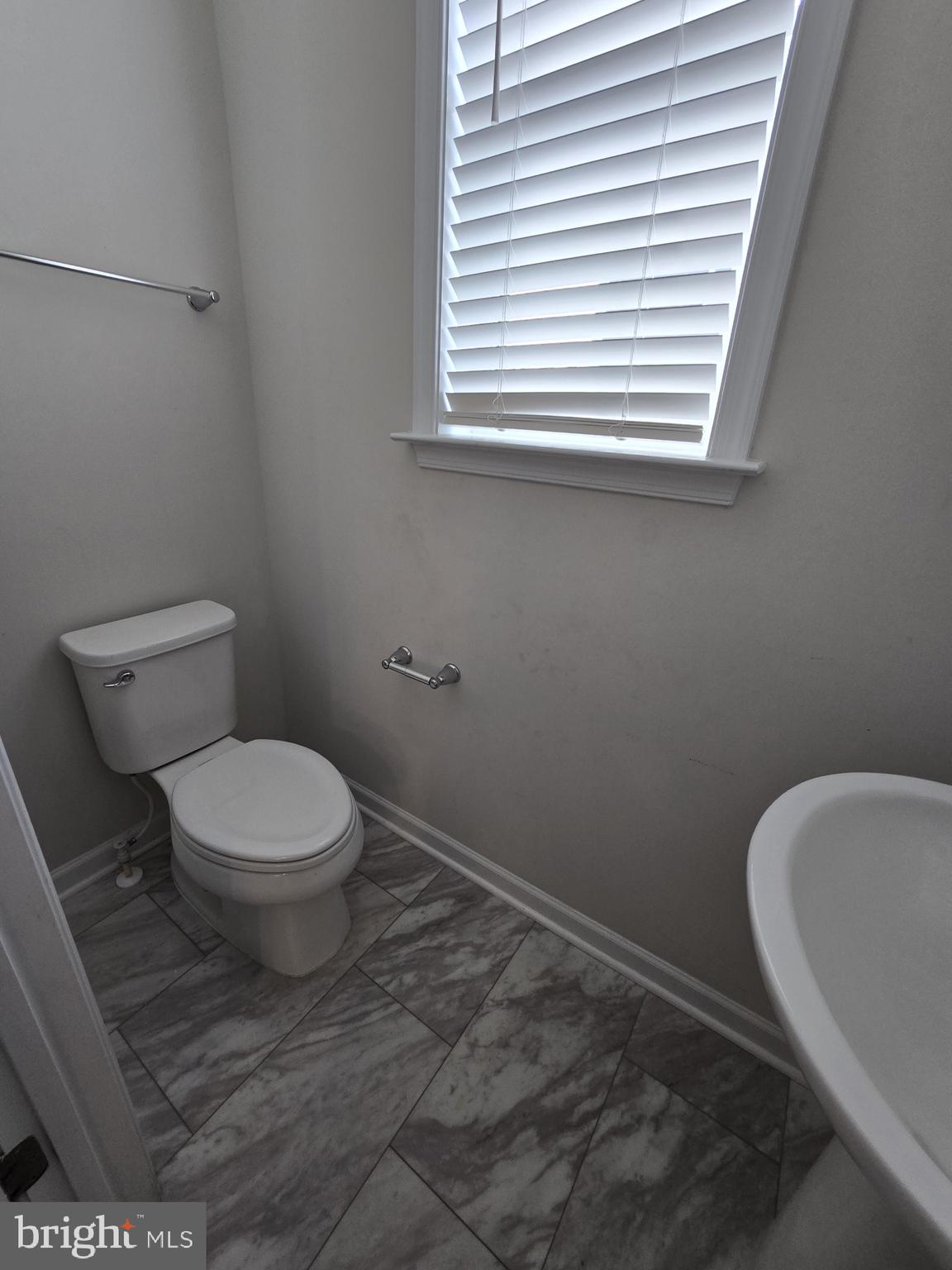 6592 Timber Ridge Lane Bryans Road, MD 20616 - Photo 27 of 60 a bathroom with a toilet and a window
