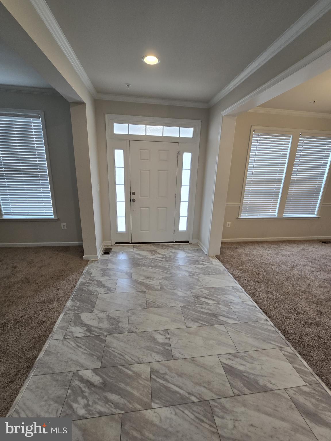 6592 Timber Ridge Lane Bryans Road, MD 20616 - Photo 3 of 60 an empty room with wooden floor and windows