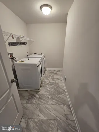 a spacious bathroom with a double vanity sink and mirror