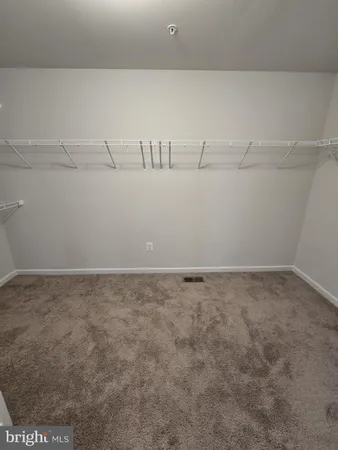 an empty room with a empty space and a window