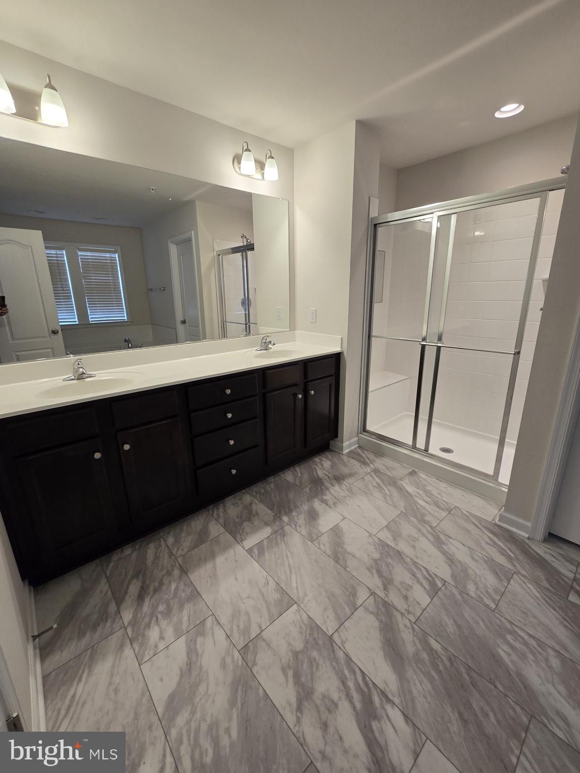 6592 Timber Ridge Lane Bryans Road, MD 20616 - Photo 38 of 60 a spacious bathroom with a double vanity sink and mirror
