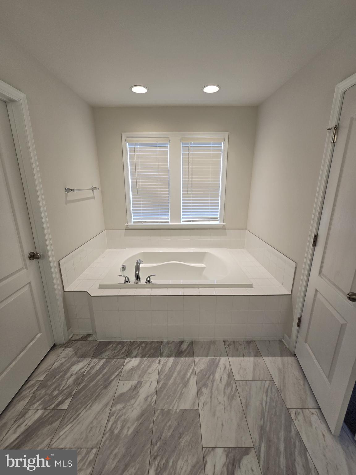 6592 Timber Ridge Lane Bryans Road, MD 20616 - Photo 39 of 60 a bathroom with a bathtub and shower