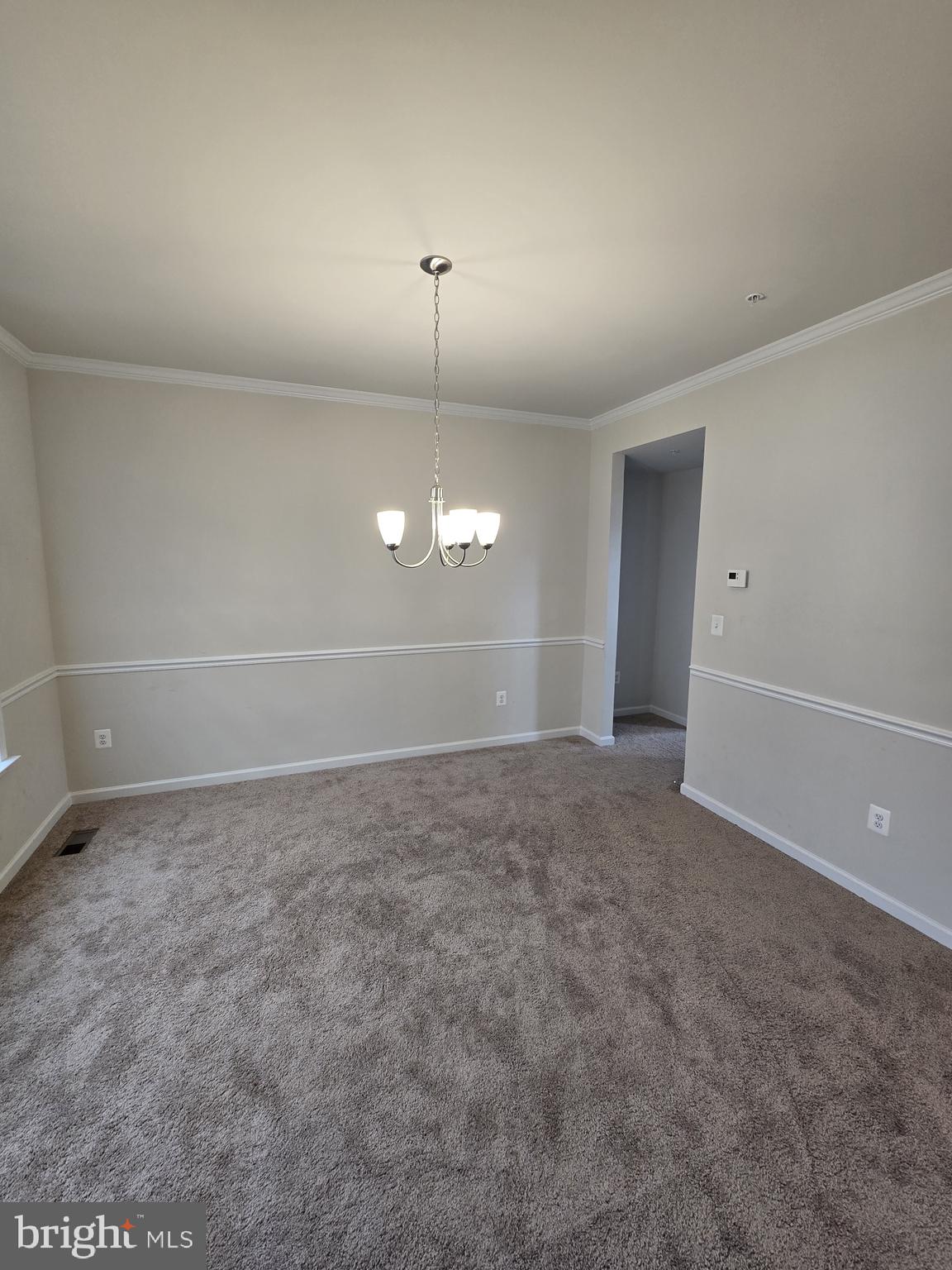 6592 Timber Ridge Lane Bryans Road, MD 20616 - Photo 7 of 60 a view of an empty room with a chandelier fan