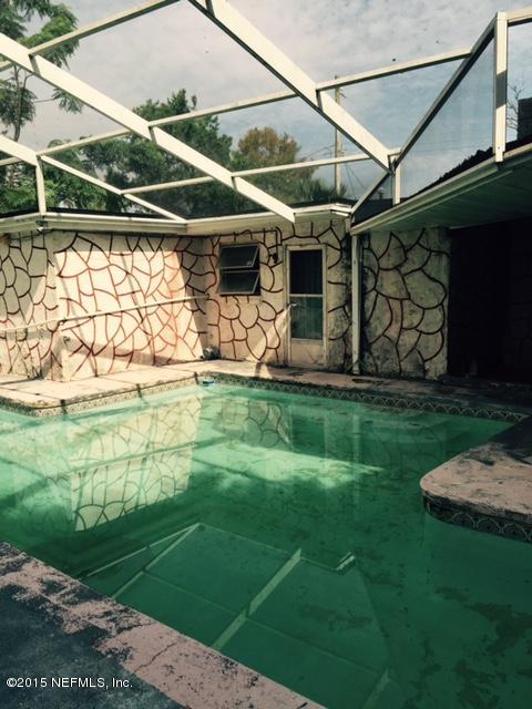 720 Triton Road Atlantic Beach, FL 32233 - Photo 1 of 1 a view of a backyard with plants and a garden