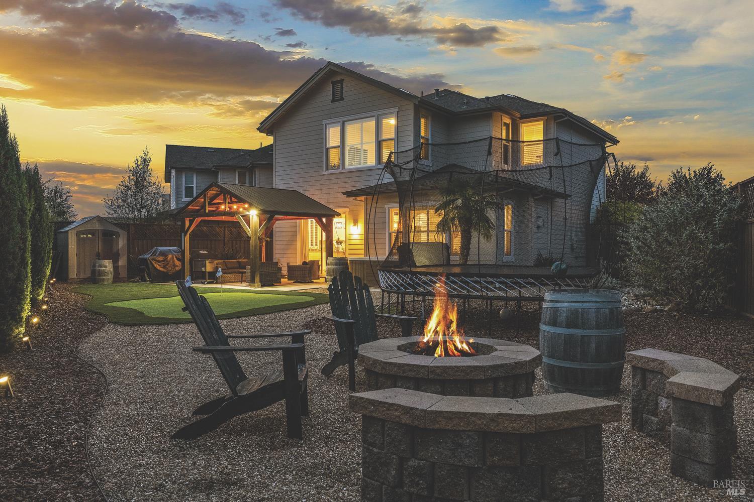 3686 Hillary Court Santa Rosa, CA 95403 - Photo 1 of 1 a view of a house with a yard fire pit and outdoor seating