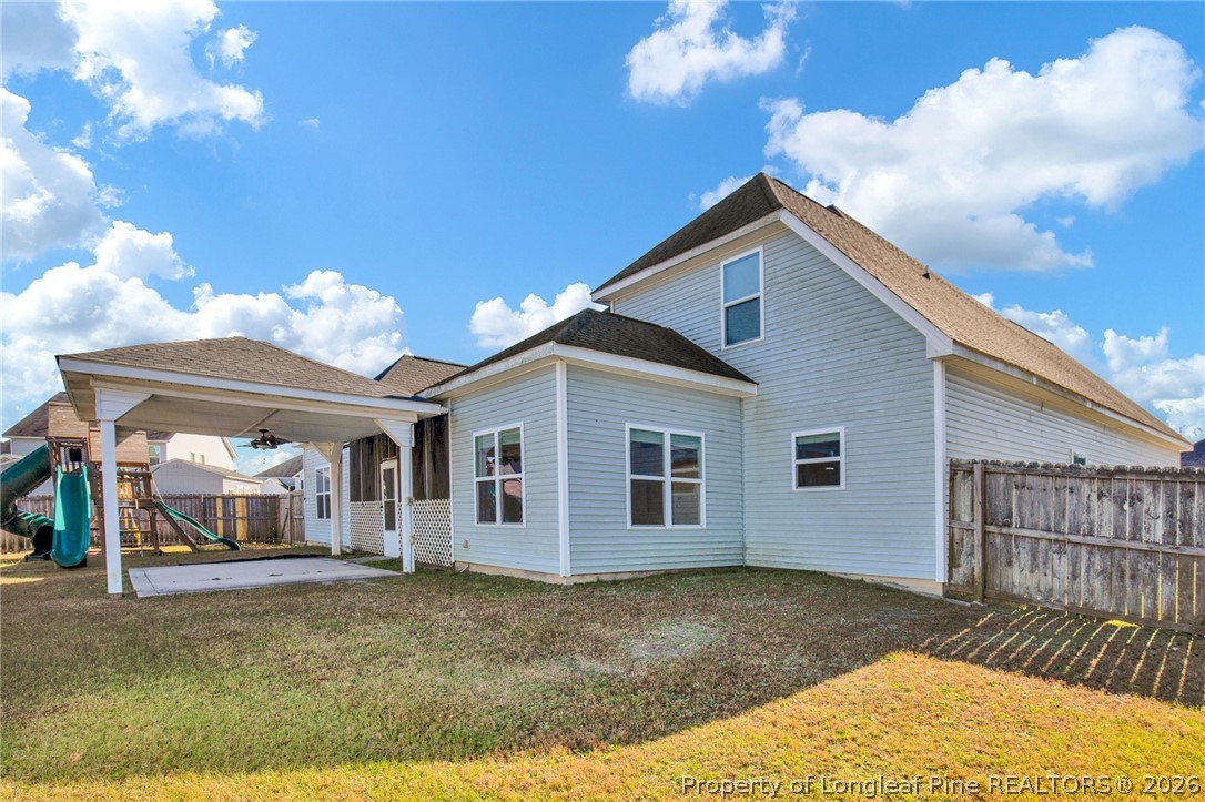 2145 Harrington Road Fayetteville, NC 28306 - Photo 48 of 50 a view of a house with a yard