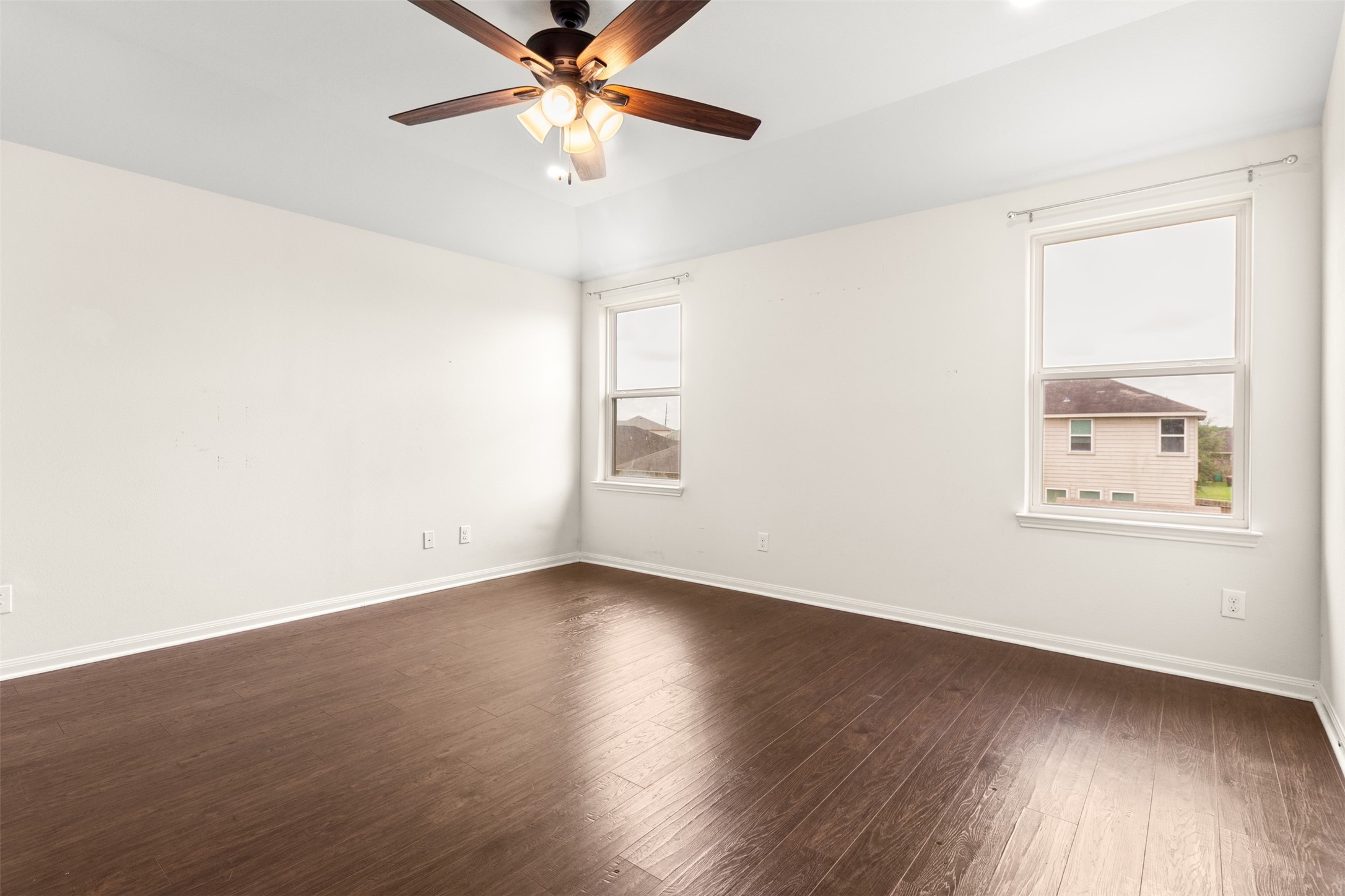 9426 Grand Spark Drive Rosharon, TX 77583 - Photo 13 of 31 The primary suite provides a peaceful retreat at the end of the day. Neutral colors, soaring ceilings, and plush carpet create a relaxing atmosphere that feels both comfortable and sophisticated.