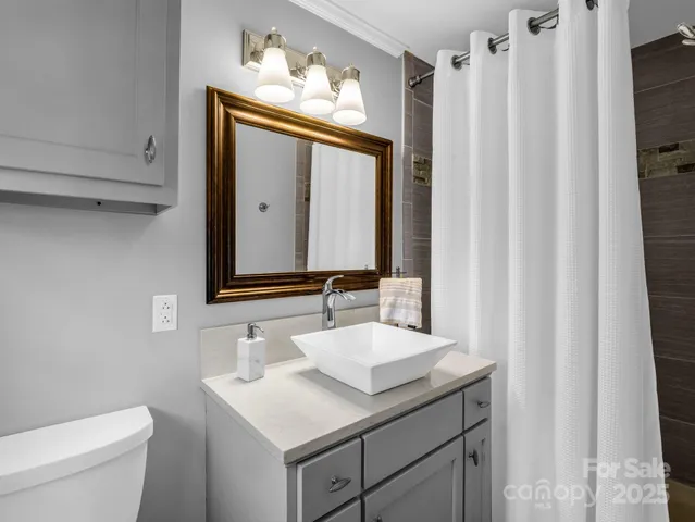 a bedroom with furniture and a wooden floor