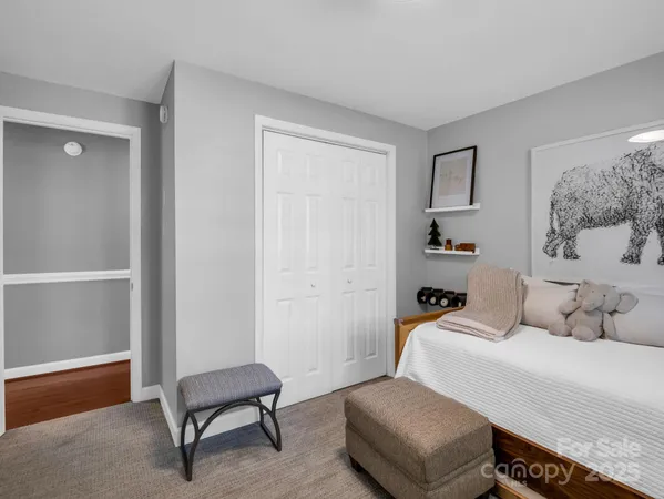 a bedroom with bed and window