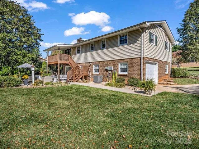 a view of a patio with chairs and a table
