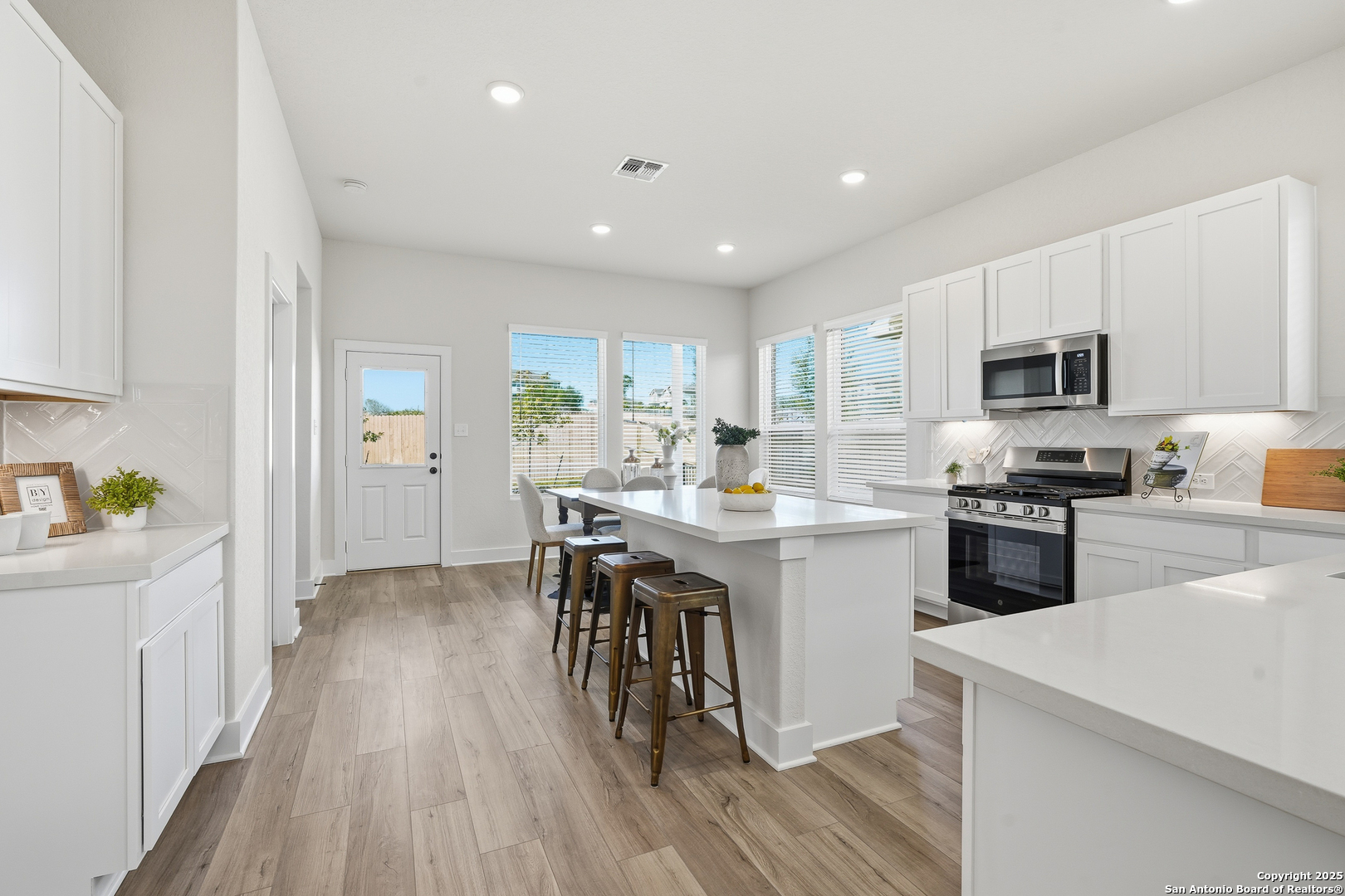 178 Jax Loop San Antonio, TX 78253 - Photo 14 of 45 a kitchen with a sink a counter top space stainless steel appliances and cabinets