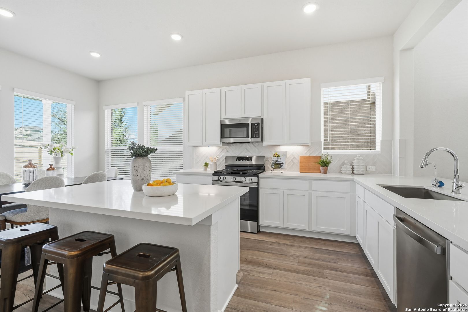 178 Jax Loop San Antonio, TX 78253 - Photo 15 of 45 a kitchen with a sink stove top oven and refrigerator