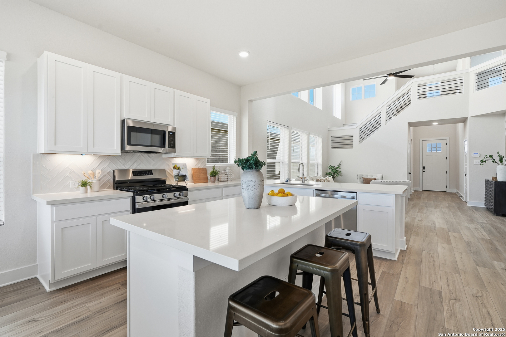 178 Jax Loop San Antonio, TX 78253 - Photo 16 of 45 a kitchen with stainless steel appliances a stove sink microwave and cabinets