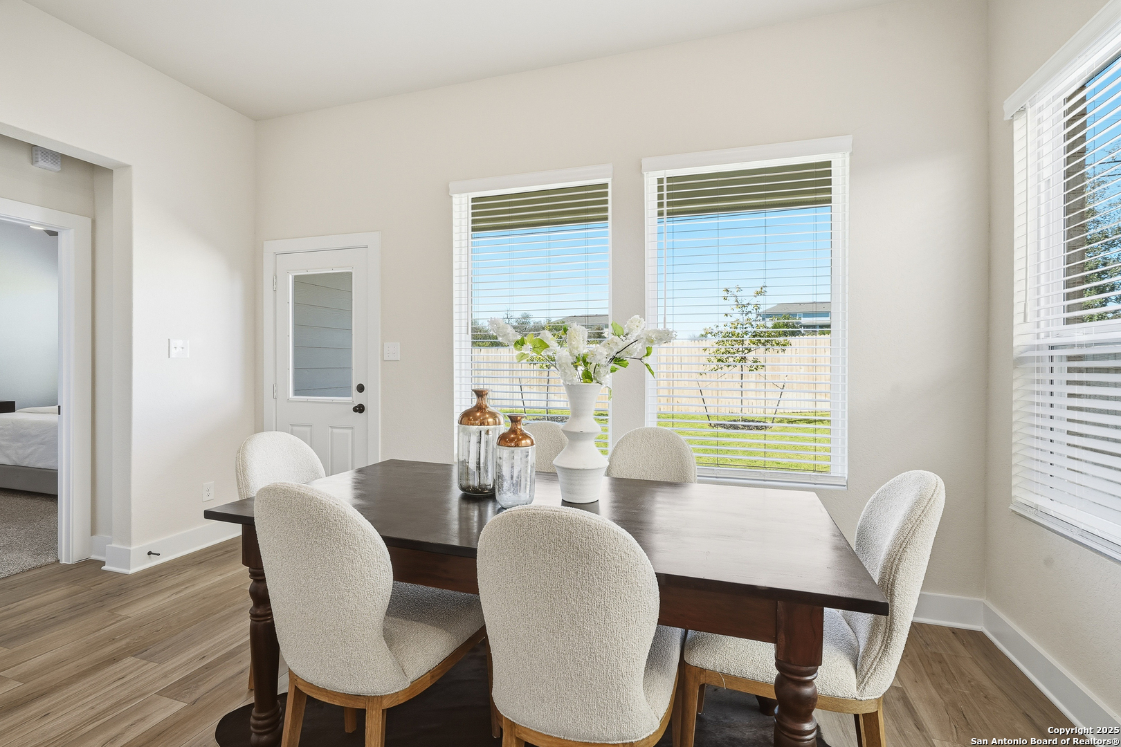 178 Jax Loop San Antonio, TX 78253 - Photo 20 of 45 a view of a dining room with furniture a chandelier and wooden floor