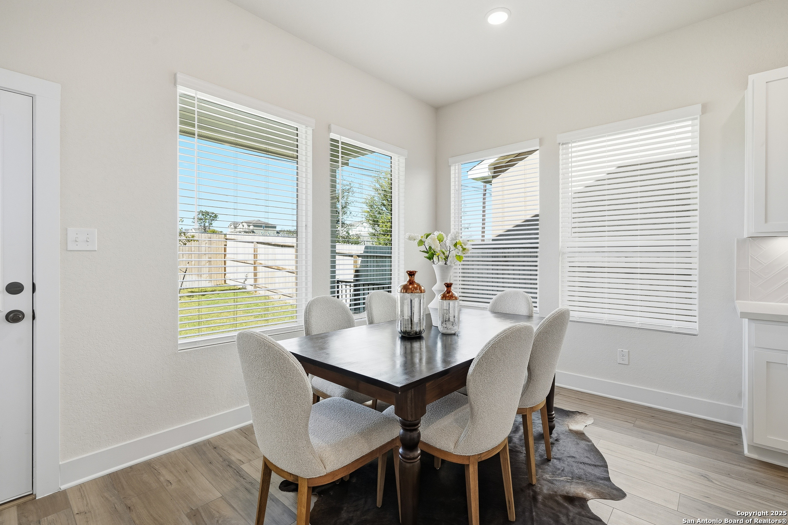 178 Jax Loop San Antonio, TX 78253 - Photo 21 of 45 a view of a dining room with furniture windows and wooden floor