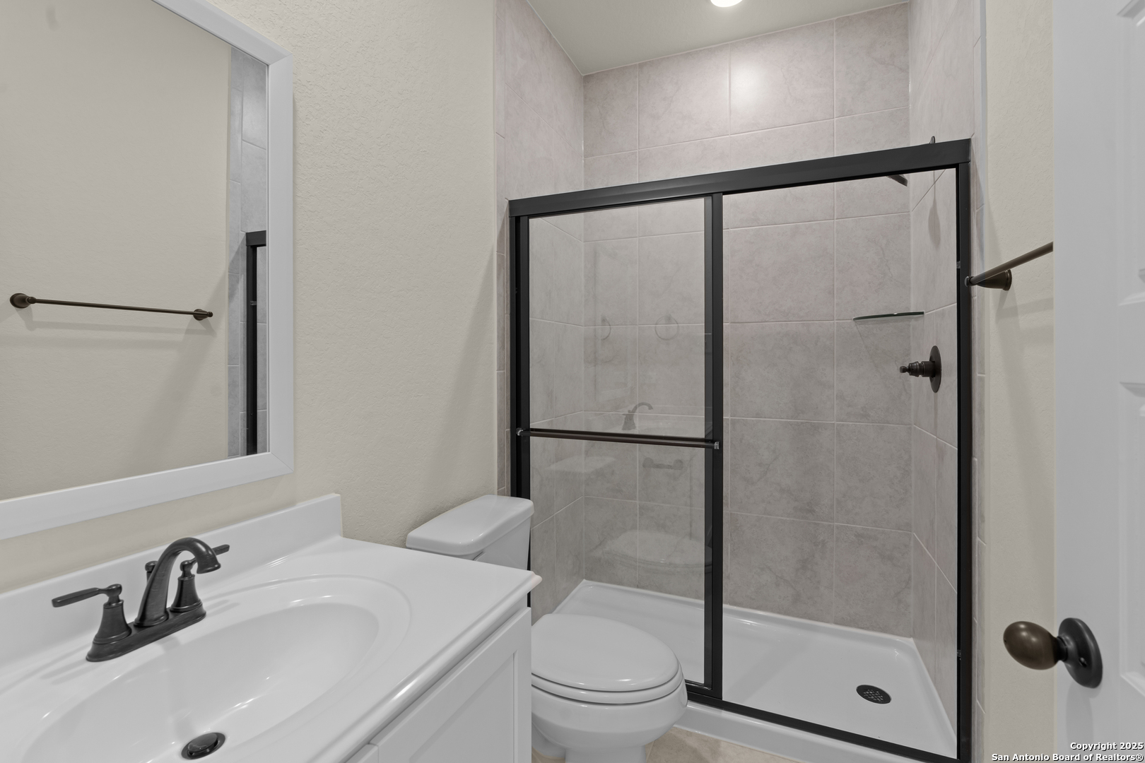 178 Jax Loop San Antonio, TX 78253 - Photo 31 of 45 a bathroom with a sink and a mirror