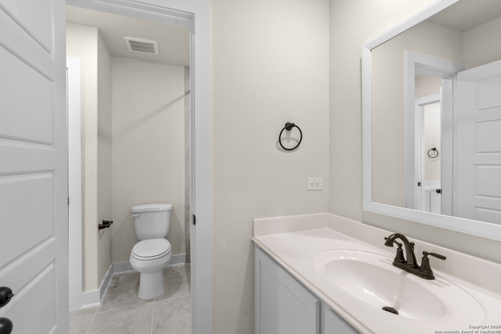 178 Jax Loop San Antonio, TX 78253 - Photo 36 of 45 a bathroom with a sink toilet and mirror