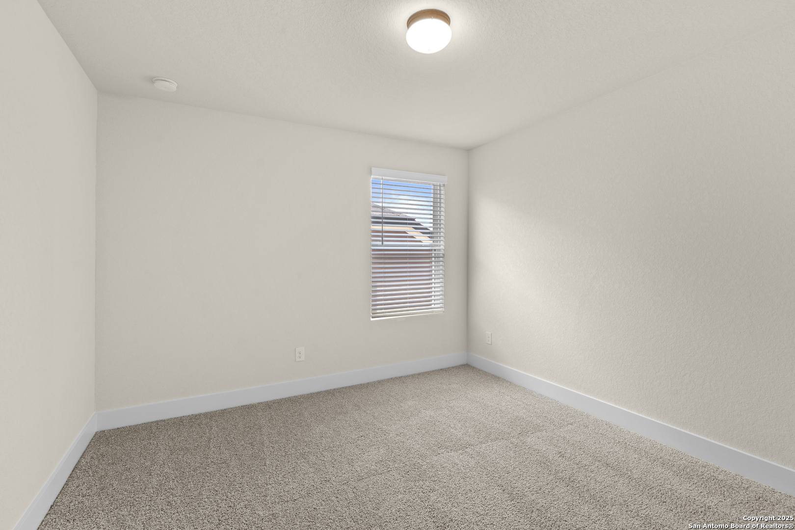 178 Jax Loop San Antonio, TX 78253 - Photo 37 of 45 a view of an empty room with a window