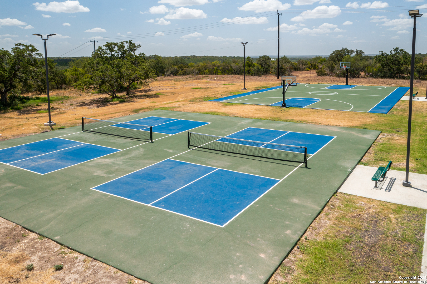 178 Jax Loop San Antonio, TX 78253 - Photo 42 of 45 a view of an empty room with swimming pool and an outdoor space