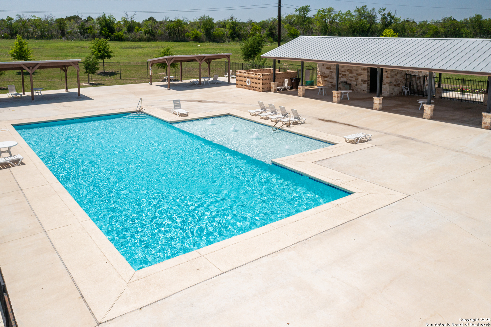 178 Jax Loop San Antonio, TX 78253 - Photo 43 of 45 a view of a swimming pool with a patio and a yard