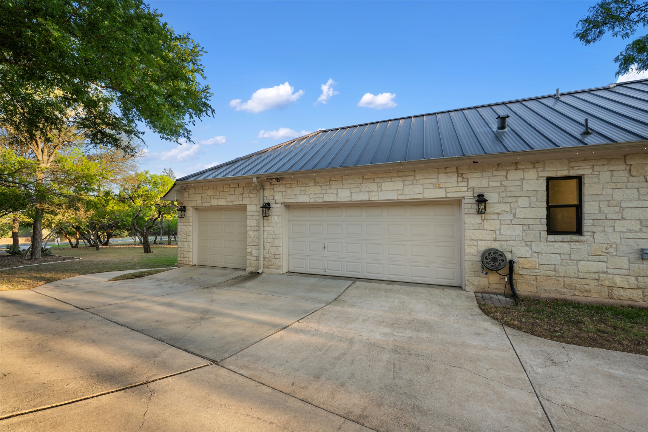 181 Whitney Run Buda, TX 78610 - Photo 37 of 40 Side entry 3-car garage.