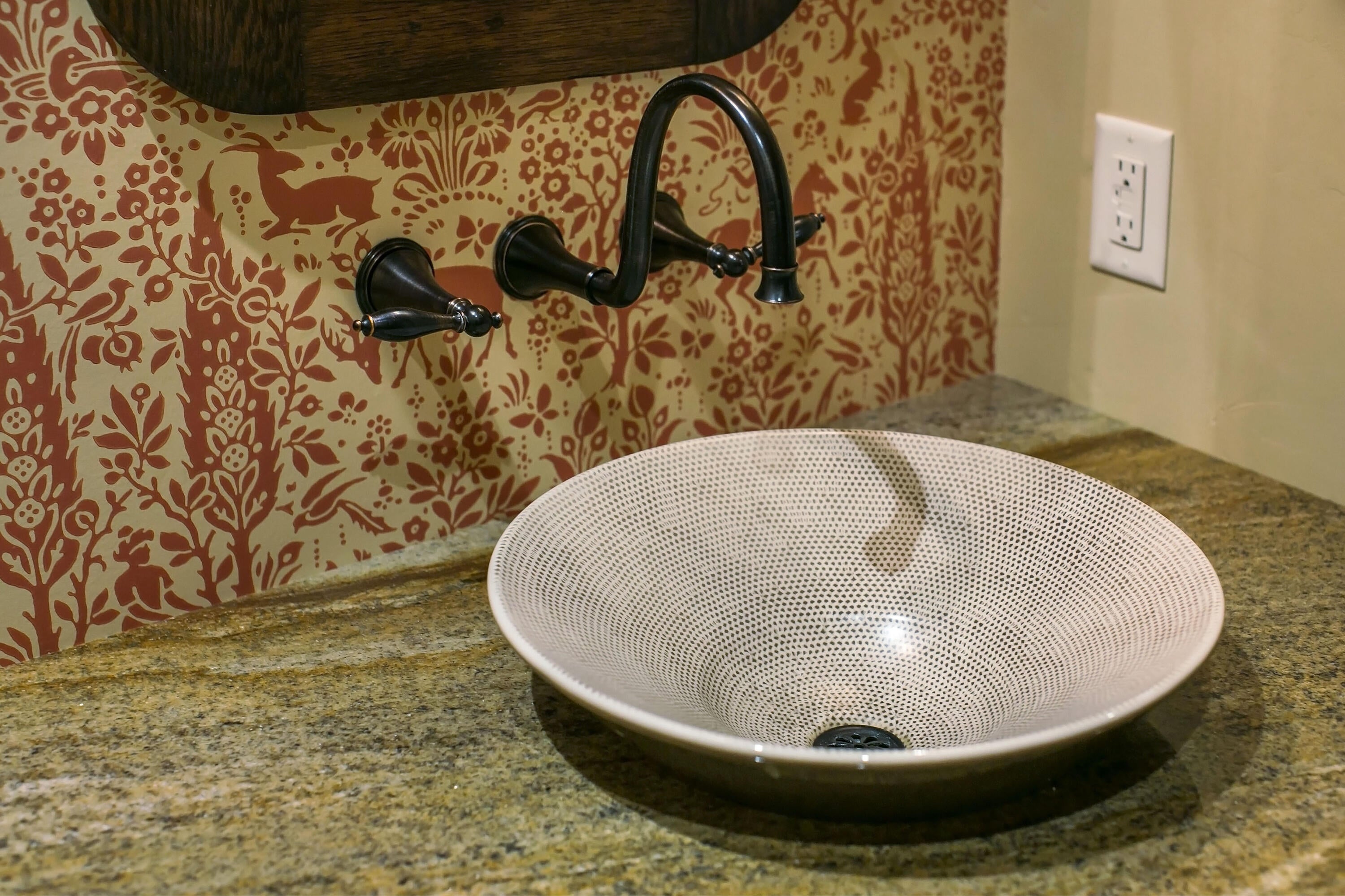 69015 Hurtley Ranch Road Sisters, OR 97759 - Photo 25 of 88 Main level half bath with granite countertop and bowl basin