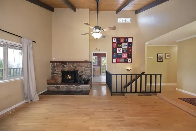 a bedroom with a bed a window and dresser