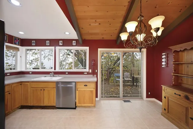 a bathroom with a granite countertop toilet sink and bathtub